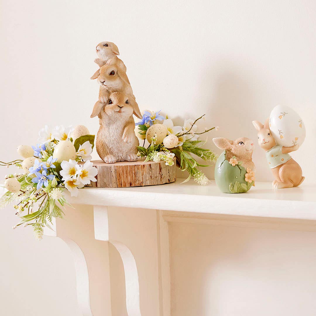https://s3-ap-southeast-2.amazonaws.com/fusionfactory.commerceconnect.bbnt.production/pim_media/000/188/846/M_F_Easter_E25_LS_Studio_Meadow-Trails-Standing-Decs_Cheeky-Bunny-Garden-Egg-Dwarf-Family-Carrying_Portrait_LS_SI.jpg?1738813496