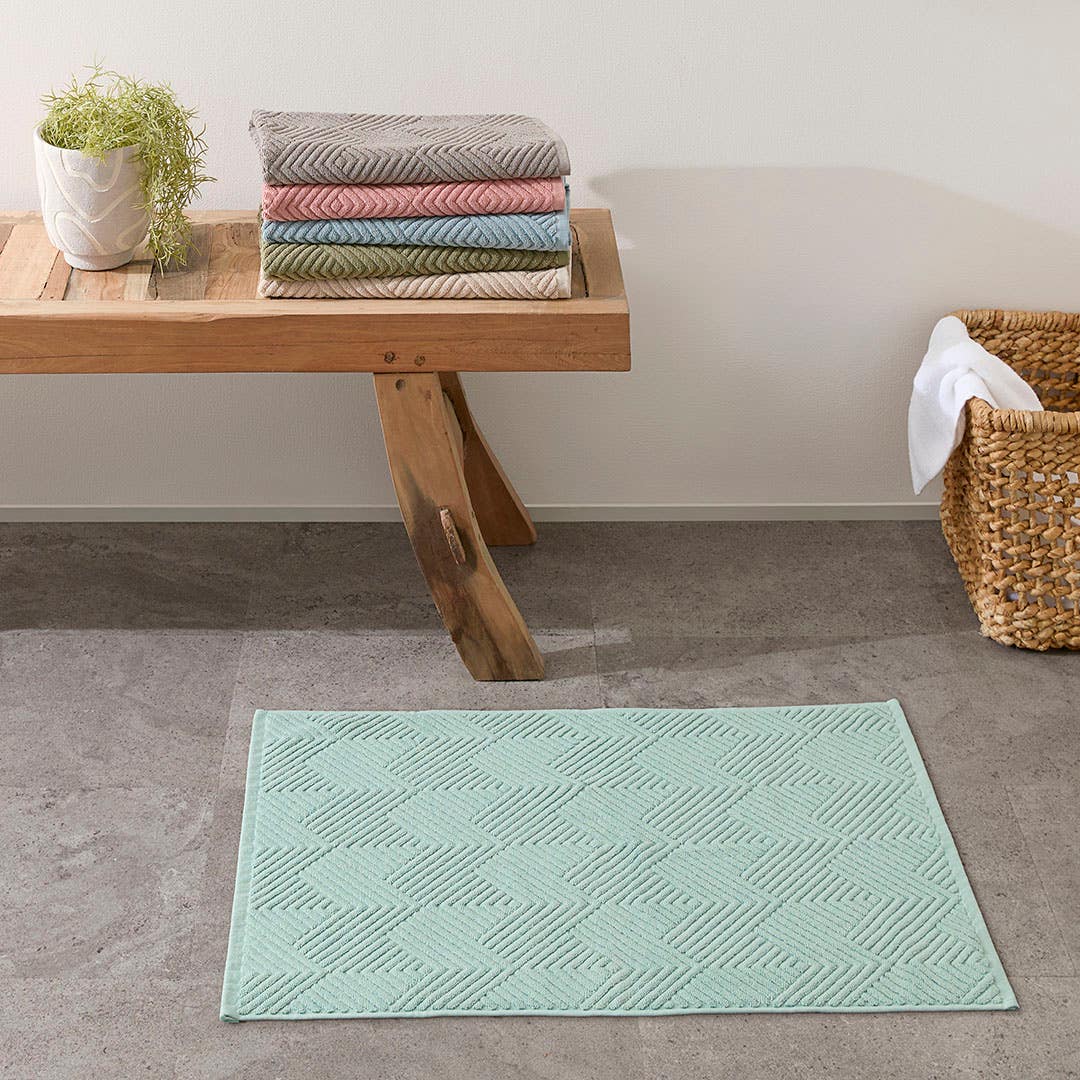 https://s3-ap-southeast-2.amazonaws.com/fusionfactory.commerceconnect.bbnt.production/pim_media/000/174/204/M_F_S24-25_Summer_LS_Studio_Bathmats-Kinsley_BM-Sea_Green.jpg?1729818287