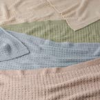 https://s3-ap-southeast-2.amazonaws.com/fusionfactory.commerceconnect.bbnt.production/pim_media/000/210/638/M_F_W26_Emmie-Knitted-Throw_Range_26938_R_V2_SI.jpg?1772588531