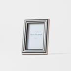 https://s3-ap-southeast-2.amazonaws.com/fusionfactory.commerceconnect.bbnt.production/pim_media/000/210/036/M_F_W26_Horgan-Resin-Frame-4x6_Navy-White_26906101_SI.jpg?1771221155