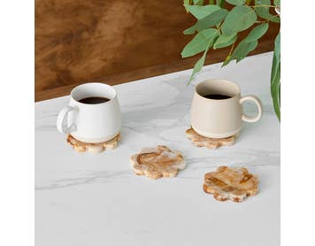 https://s3-ap-southeast-2.amazonaws.com/fusionfactory.commerceconnect.bbnt.production/pim_media/000/210/279/M_F_W26_Studio_LS_Napery_Scallop_Coaster_Resin_Coffee_SI.jpg?1771981789