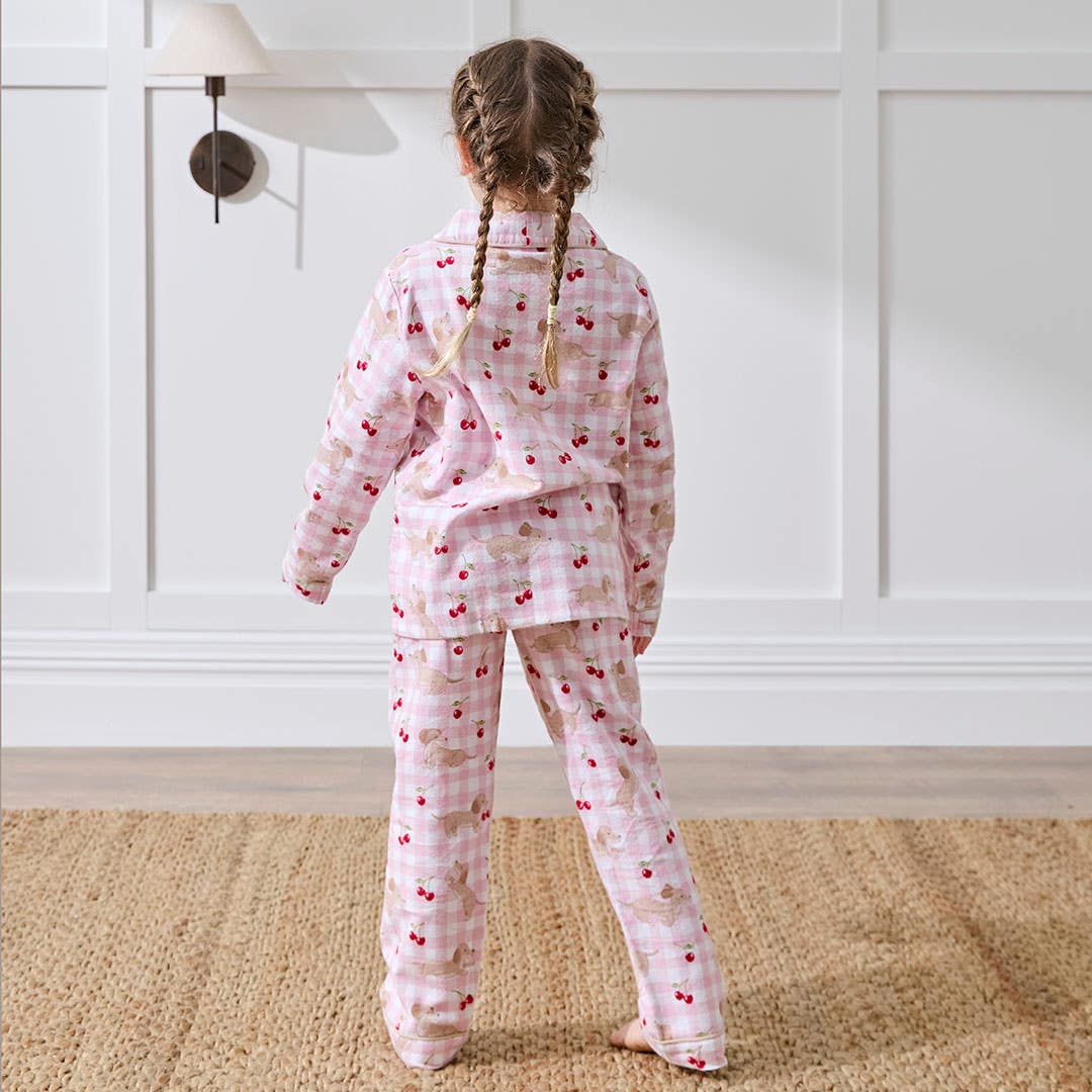 https://s3-ap-southeast-2.amazonaws.com/fusionfactory.commerceconnect.bbnt.production/pim_media/000/207/542/M_F_Winter_26_Studio_Kids_PJs-Flannel_Cherry_Dash-2_SI.jpg?1769487824