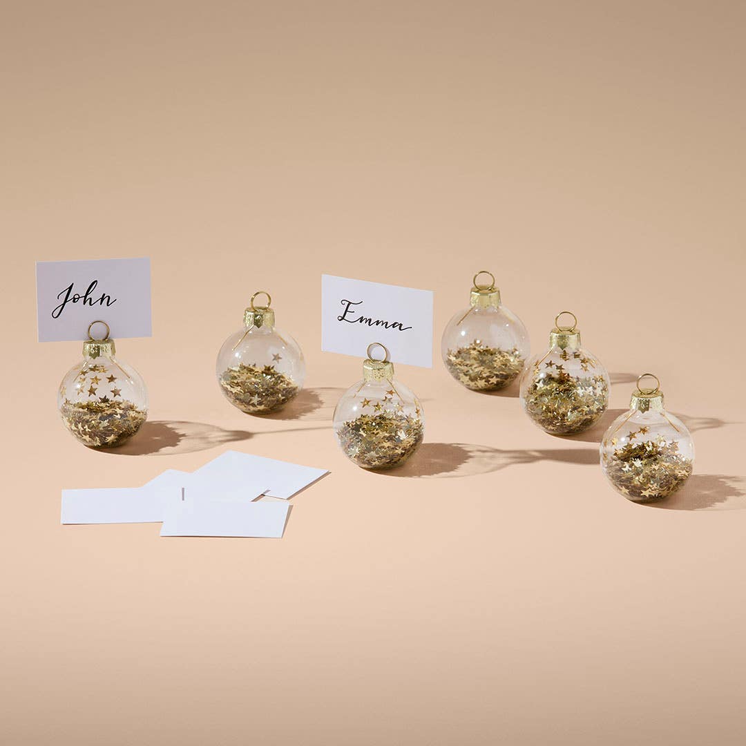 https://s3-ap-southeast-2.amazonaws.com/fusionfactory.commerceconnect.bbnt.production/pim_media/000/216/989/M_F_Xmas-26-27_CG_XMAS_DINING_Glass-Ball-Place-Card-Holder-S6-Gold_26301301_V2_SI.jpg?1783905440