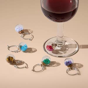 https://s3-ap-southeast-2.amazonaws.com/fusionfactory.commerceconnect.bbnt.production/pim_media/000/217/101/M_F_Xmas-26-27_CG_XMAS_DINING_Sequin-Wine-Charm-S6-Multi-Colour_22093101_SI.jpg?1783918236