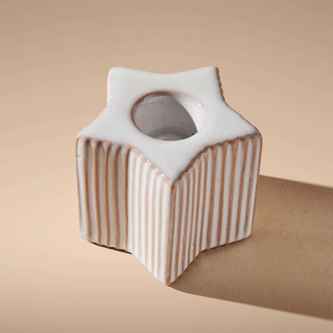 https://s3-ap-southeast-2.amazonaws.com/fusionfactory.commerceconnect.bbnt.production/pim_media/000/214/341/M_F_Xmas-26-27_HT_CANDLEHOL_Ribbed-Star-Taper-Candleholder_27032601_Detail-01_SI.jpg?1779927235