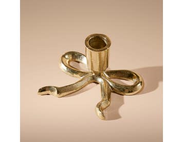 https://s3-ap-southeast-2.amazonaws.com/fusionfactory.commerceconnect.bbnt.production/pim_media/000/214/671/M_F_Xmas-26-27_MR_CANDLEHOL_Flat-Bow-Taper-Candle-Holder_27038601_SI.jpg?1781503455
