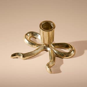 https://s3-ap-southeast-2.amazonaws.com/fusionfactory.commerceconnect.bbnt.production/pim_media/000/214/671/M_F_Xmas-26-27_MR_CANDLEHOL_Flat-Bow-Taper-Candle-Holder_27038601_SI.jpg?1781503455