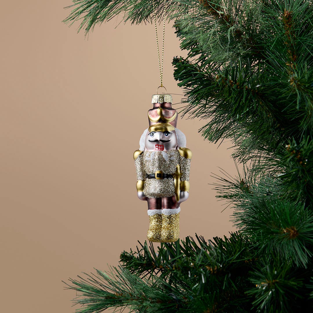 https://s3-ap-southeast-2.amazonaws.com/fusionfactory.commerceconnect.bbnt.production/pim_media/000/216/786/M_F_Xmas-26-27_S4_HT_DECS_Glass-Nutcracker-Dec_27075201_SI.jpg?1783653051